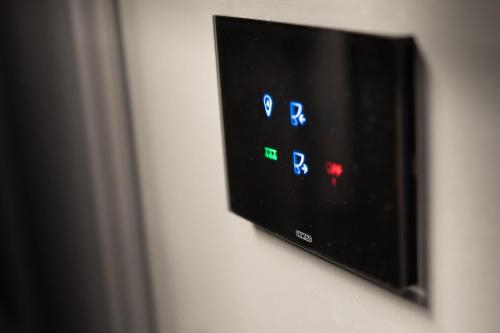 a flat screen tv hanging on a wall at Elysium Residence in Timişoara