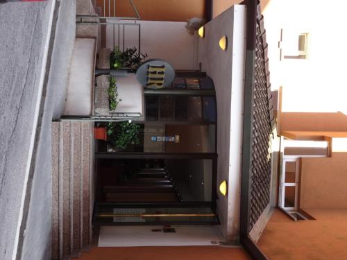 a stairwell in a building with plants at Hotel Roma in Cividale del Friuli