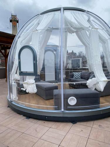 a dome tent with a living room in it at OLYMPIC 84 Apartments in Sarajevo