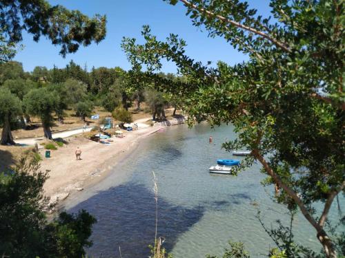 a view of a beach with boats in the water at Notoshouse in Nótos