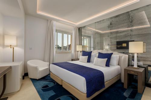 Кровать или кровати в номере Room Mate Gran Filippo