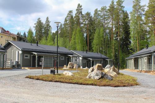 a group of buildings with rocks in front of them at Spa Hotel Rauhalahti in Kuopio