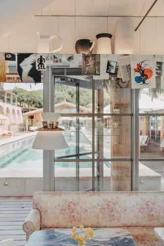 a living room with a couch and a pool at Lily of the Valley in La Croix-Valmer
