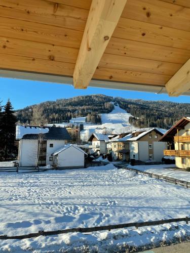 a view from the roof of a house in the snow at Familienhaus Kreischberg in Sankt Georgen ob Murau