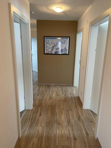 a hallway of a home with wood floors at Chalet Fügen in Fügen
