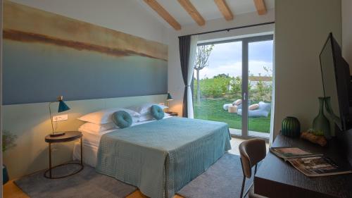 En eller flere senge i et værelse på Villa Tramonto