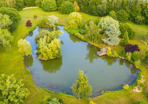 an aerial view of a lake in a park at Cadnam Lodge in Cadnam