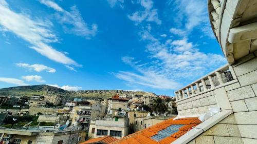 a view of a city from the roof of a building at Zohara in Naḥf