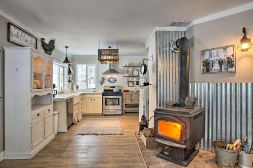 a kitchen with a stove in the middle of it at Modern Farmhouse with Movie Room - 6 Mi to Lake! in Coeur d'Alene