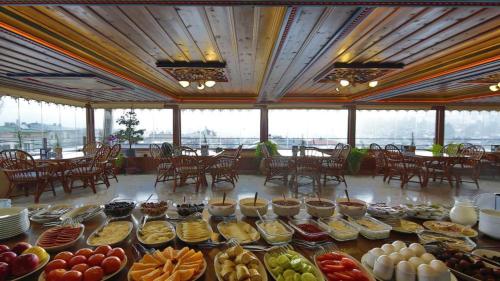 a buffet of food on a table in a restaurant at Safran Cave Hotel in Goreme