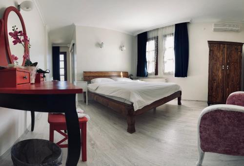 A bed or beds in a room at Hotel Erol - Adult Only