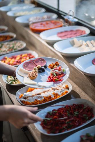 a table full of plates of food on a table at World Heritage Center Hotel in Istanbul