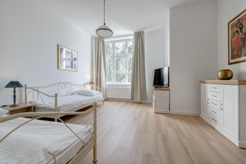 Posteľ alebo postele v izbe v ubytovaní DR Apartments - Fryderyk