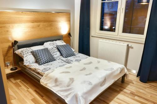 Posteľ alebo postele v izbe v ubytovaní LAGUNA Apartament 7 Willa Maria
