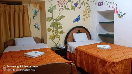 Postel nebo postele na pokoji v ubytování Hostal sambleño cusco Piero suite