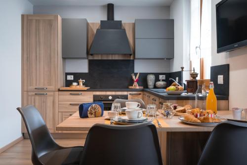 a kitchen with a table with food on it at Alla Vecchia Contrada B&B in Provaglio Val Sabbia