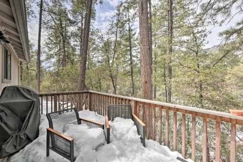 a deck with two chairs and snow on it at about 8 Mi to State Park and Trails Pine Mountain Home in Pine