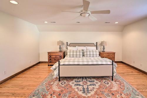 a bedroom with a bed and a ceiling fan at Secluded Hilltop Columbia Home with Deck and Views! in Columbia