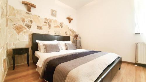 Postel nebo postele na pokoji v ubytování Apartments Angir