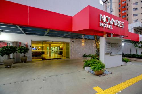 a noones home sign on the front of a building at Novares Hotel in Goiânia