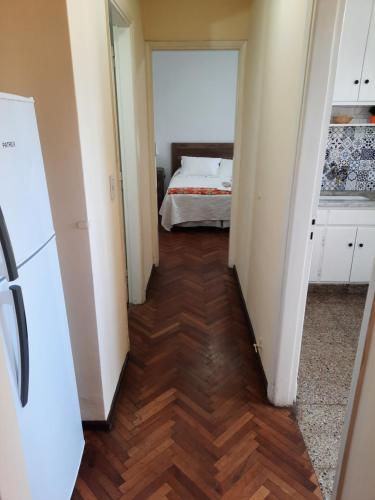 a hallway with a bedroom and a bed in a room at Piazza Mendoza in Mendoza