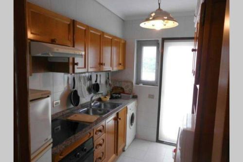 a kitchen with a sink and a stove top oven at A 300 mètre de la plage plein centre alcossebre in Alcossebre