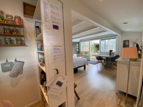 a room with a wall with a poster on it at Studio Clematis Bergen in Bergen