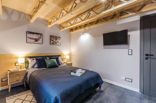 Una cama o camas en una habitación de 3 WYMIARY