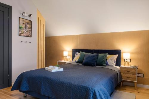 Una cama o camas en una habitación de 3 WYMIARY