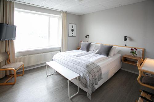 Posteľ alebo postele v izbe v ubytovaní Hotel Norðurland