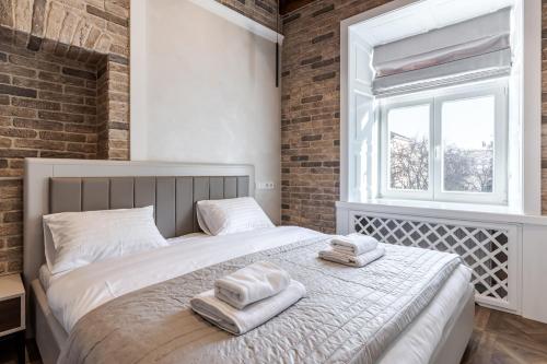 Cama o camas de una habitación en View on Rynok Square apartments