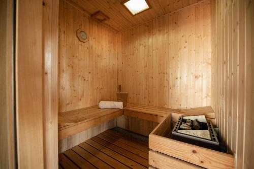 a wooden sauna with a bench in the middle at Boutique B&B Mali Pariz in Crikvenica