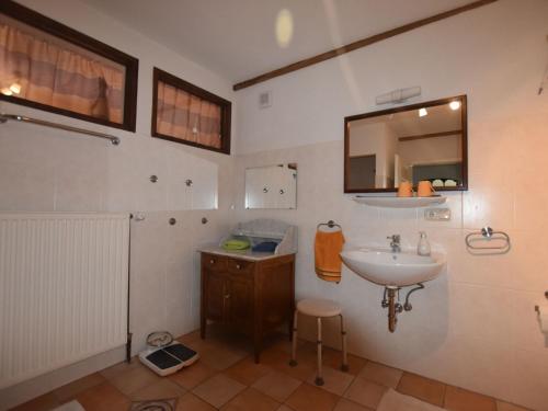 a bathroom with a sink and a mirror at Buschenhagen Rustic Getaway in Buschenhagen