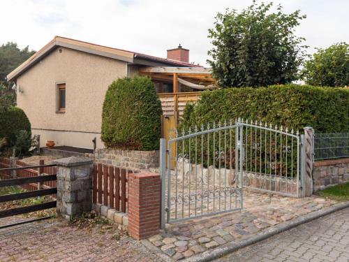 a gate in front of a house at Apartment in Warin in der N he des Glammsees in Warin