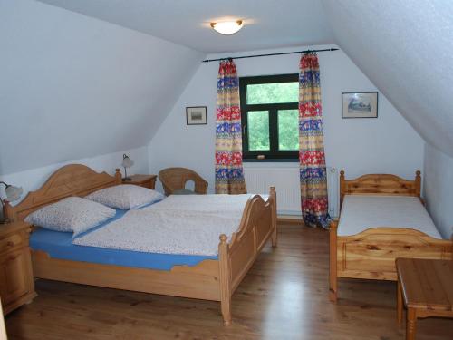 a bedroom with two beds and a window at Elegant Mansion in Barlin with Swimming Pool in Barlin