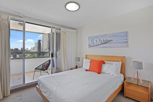 מיטה או מיטות בחדר ב-Tweed Ultima Apartments