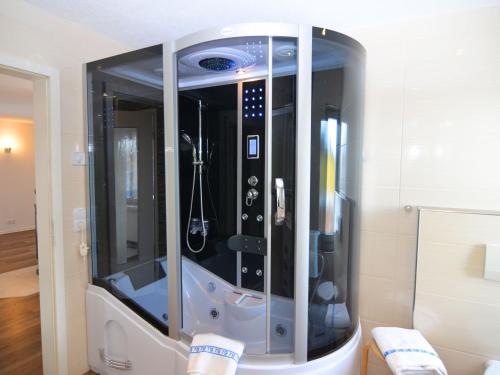 a large shower in a room with at Beautiful holiday home in the Thuringian Forest with fireplace and whirlpool in Schnett