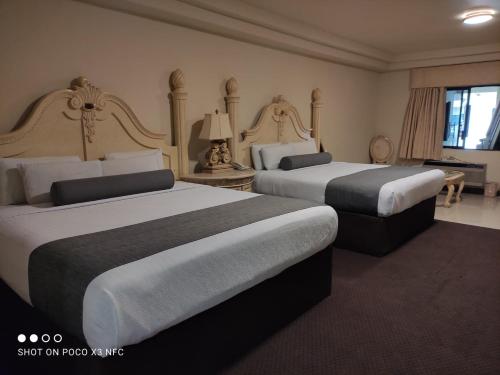 Ліжко або ліжка в номері Hotel Frontiere Tijuana