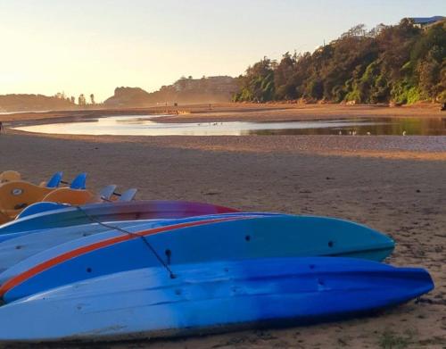 a group of surfboards sitting on the beach at The Clan Terrigal in Terrigal