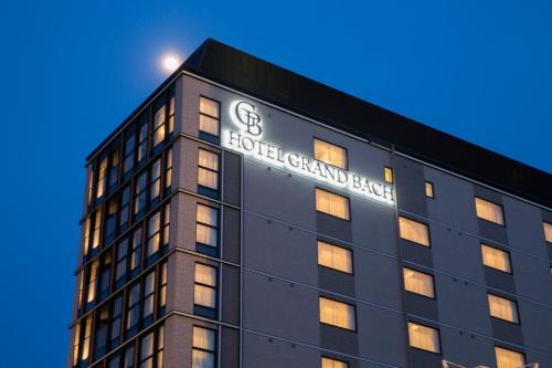 a building with a sign on the side of it at Hotel Grand Bach Kyoto Select in Kyoto