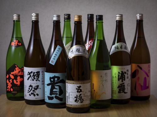 a group of bottles of wine on a table at Hotel Wing International Shimonoseki in Shimonoseki