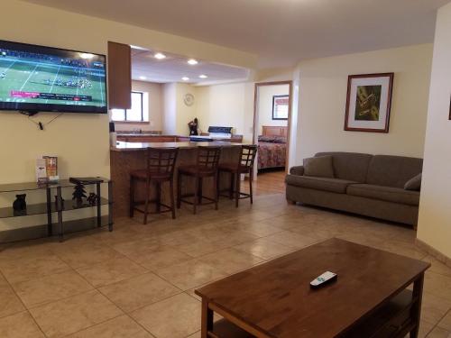 a living room with a couch and a table at Amber's Inn and Suites in Wisconsin Dells