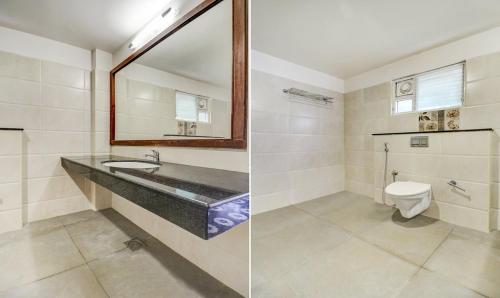 a bathroom with a sink and a toilet at RR INN Group Of Hotels in Kanyakumari