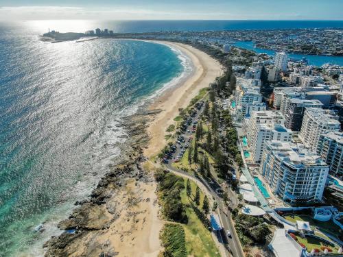 an aerial view of a beach and the ocean at Oceans Mooloolaba in Mooloolaba