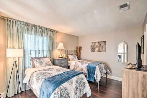 a bedroom with two beds and a window at Pet-Friendly A-Frame Retreat Near Dtwn and Beaches! in Pensacola