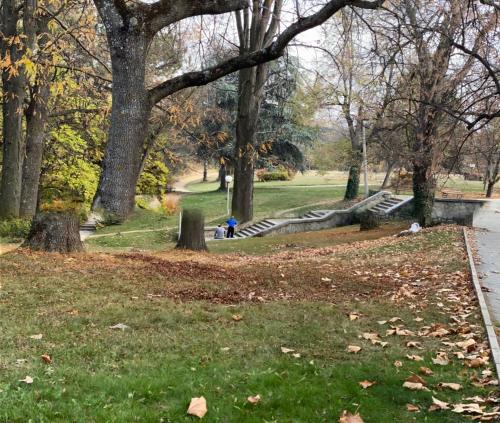 a person sitting on a bench in a park at Fantasy Apartment 15 комплекс Фантазия, Хисаря in Hisarya