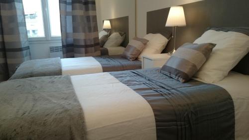 Ένα ή περισσότερα κρεβάτια σε δωμάτιο στο Cannes Plage