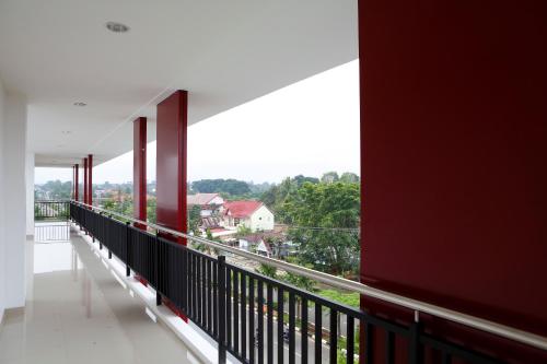 a balcony with a view of a city at Amaris Hotel Muara Bungo - Jambi in Bebeko