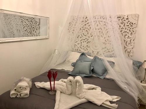 A bed or beds in a room at La Siciliana-di fronte la Cattedrale