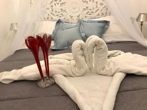 A bed or beds in a room at La Siciliana-di fronte la Cattedrale